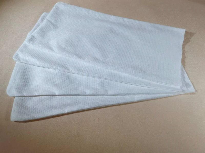 Disposable Pillowcases - White disposable nonwoven pillowcases in 60–70 gsm, available in 100% viscose or 70% viscose / 30% polyester, with common hotel and spa sizes.